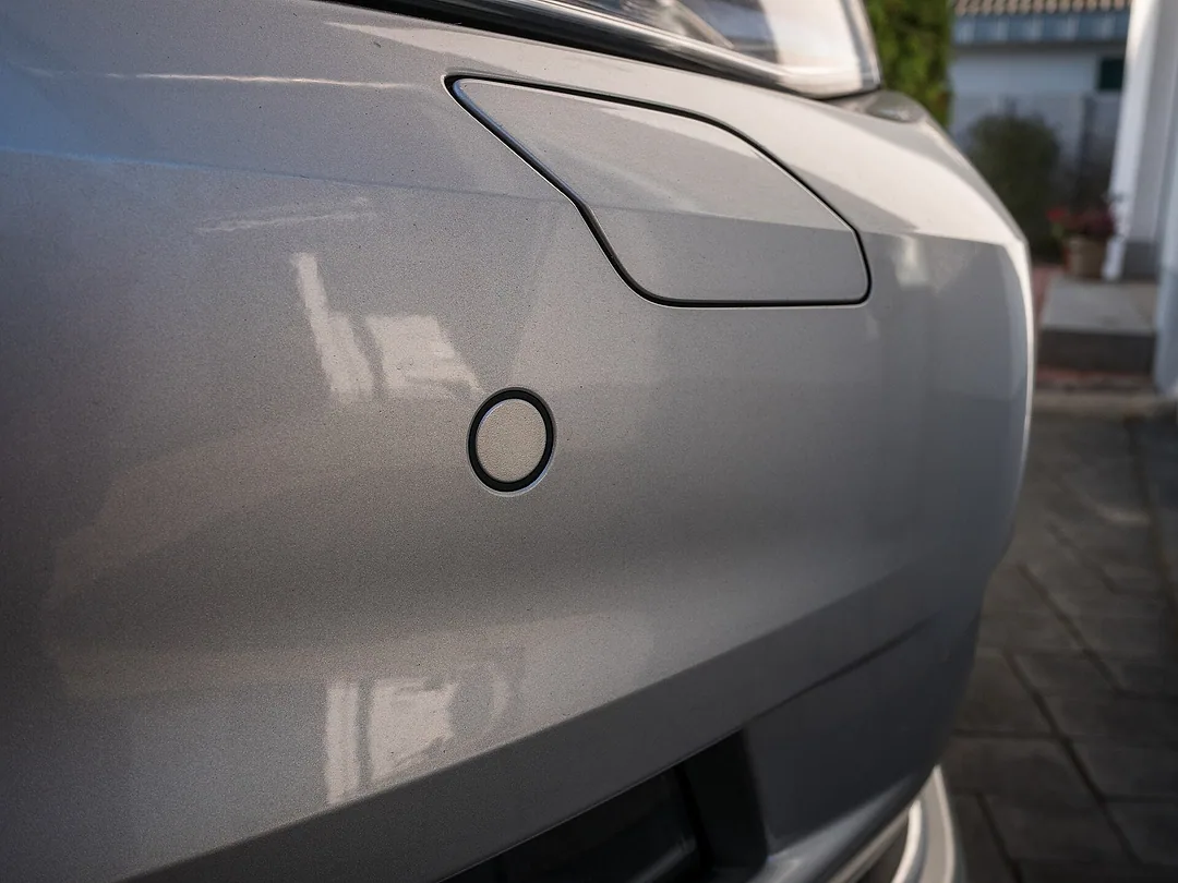 A parking sensor set flush into a car's bumper